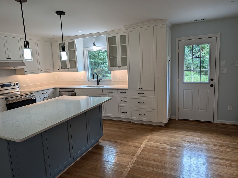Custom cabinets throughout the kitchen and island