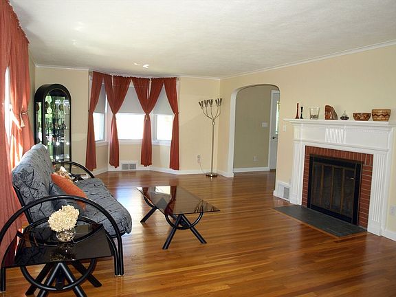 Living Room , Fireplace and archway to the dining area.