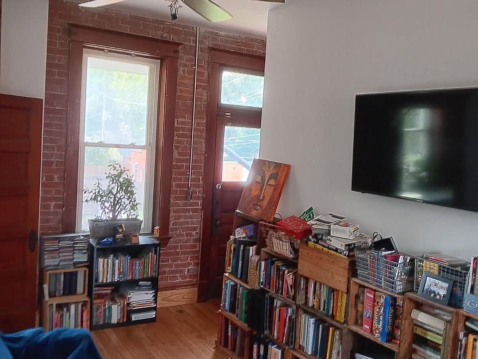 Sitting area adjacent to room. Balcony access through door.
