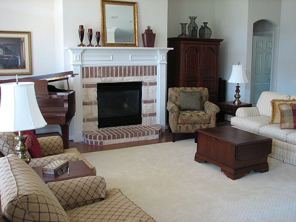 spacious living room with gas log fireplace