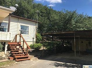 Stair and Landing to enter house. Carport
