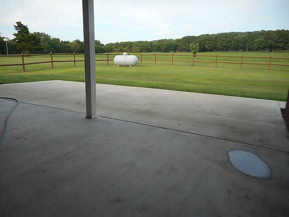 28 x 32 covered patio opening into backyard