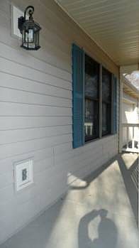 Large front porch is so inviting.