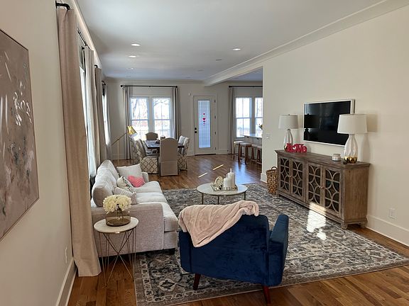 downstairs living space open to dining room and kitchen