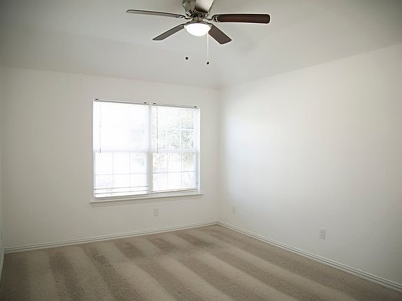 Bedroom on the left side of the house. Window faces the street view.