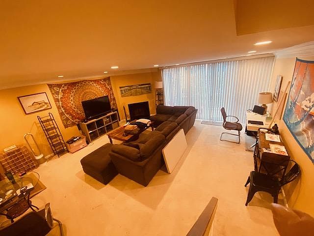 Living room/dining room area is very spacious, it fits a huge sectional, desks and a dinning room table
