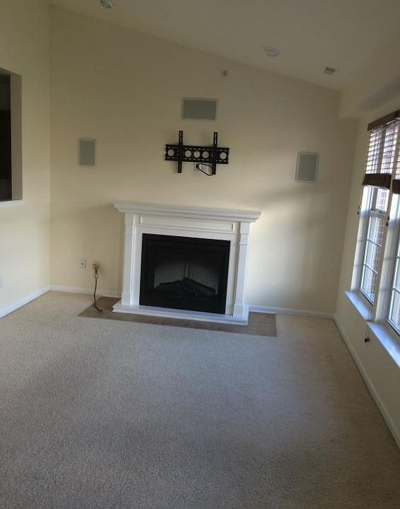 Living room with fireplace,TV mount and in built speakers