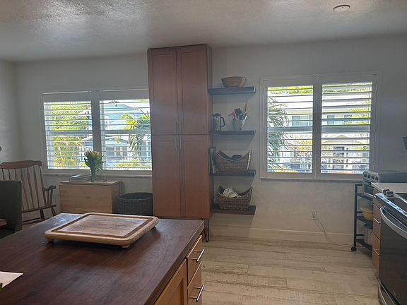 Pantry and open shelving. Plenty of storage.