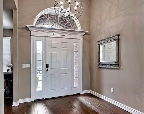 Gorgeous, Updated Wide Plank Hardwood Flooring & Modern Lighting Welcome all who enter...