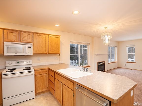 From private first floor master suite slip out into kitchen to grab an early morning cup of coffee as you walk out onto deck to greet the morning! Bosch stainless steel dishwasher.