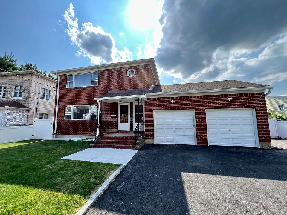 Left door enters to first floor apartment - 3 full bedrooms 1 bath, new kitchen and storage area.