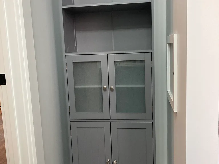 Plenty of shelving in master bath.