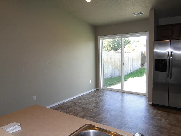 Sliding glass doors to back yard