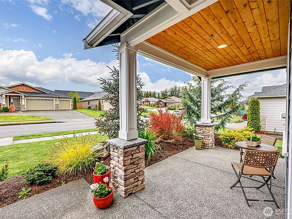 The thoughtfully designed landscaping offers a sense of privacy at the front entry, creating a welcoming atmosphere. You'll find that the yard is so well-maintained, making it easier for you to keep it looking beautiful without a lot of effo>
