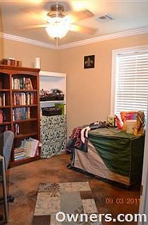 Guest Bedroom 2 with custom stained concrete floors.
