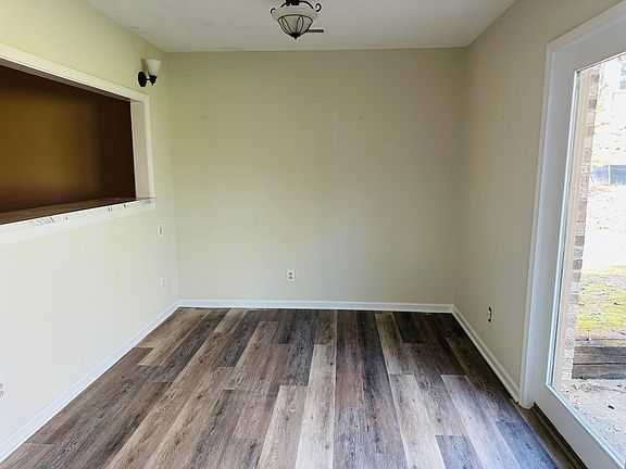 Dining room with built-in counter & window leading to private patio access