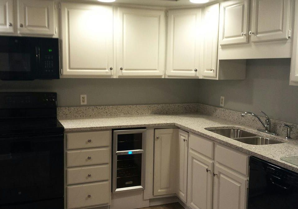 Kitchen with granite counters and wine cooler