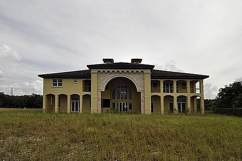 Plenty of room to design your pool/patio with summer kitchen!