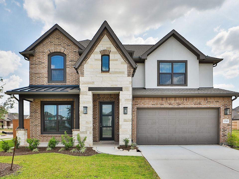 Distinctive stone and brick facade, elegant arched windows. Located in Sunterra s exclusive enclave.