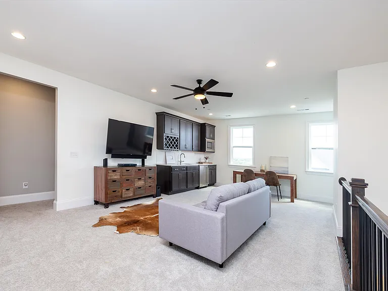 Gameroom Foyer in second floor with kitchenette .
