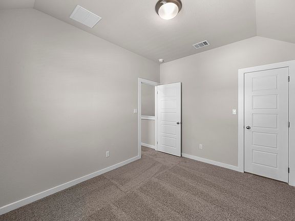 Bedroom in the Magnolia home plan by Trophy Signature Homes - REPRESENTATIVE PHOTO