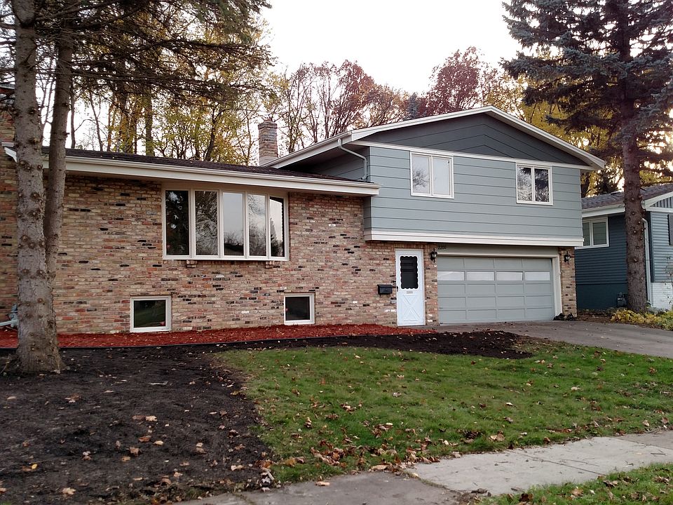 Attractive multi level split entry home with tuck under doub