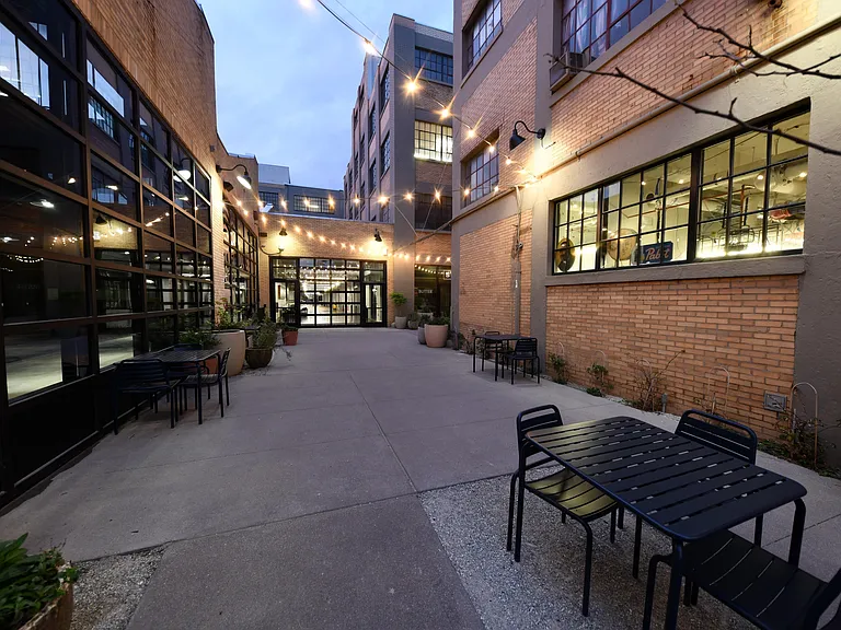 Redeveloped historic building featuring restaurants like Amelia's Bread, Barista Parlor, and Cafe Patachou. Features retail and fitness shops like Grounded Plant & Floral Co., Myriad + Fitness, and St'artup317. Only 1 mile from The Block.