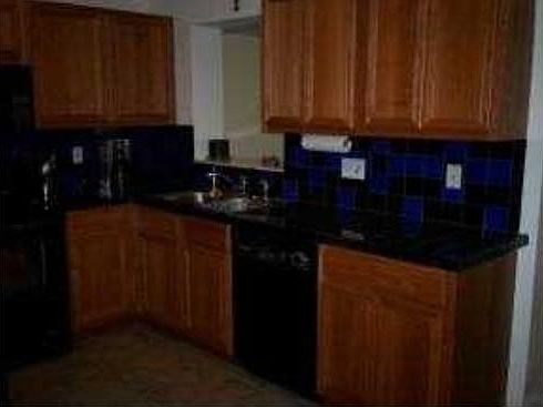 Wood cabinets and tile counters