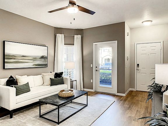 Bathe in sunshine and spacious living where wood-style floors and natural light create a haven of comfort.
