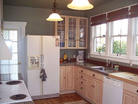 Updated kitchen with new countertops, and french doors leading to deck