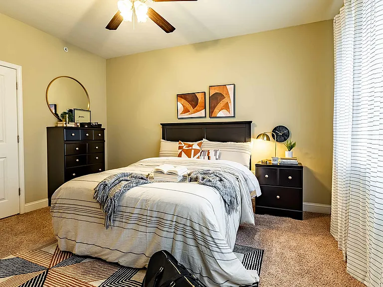 Experience comfort and style in this beautifully designed bedroom, perfect for relaxation.