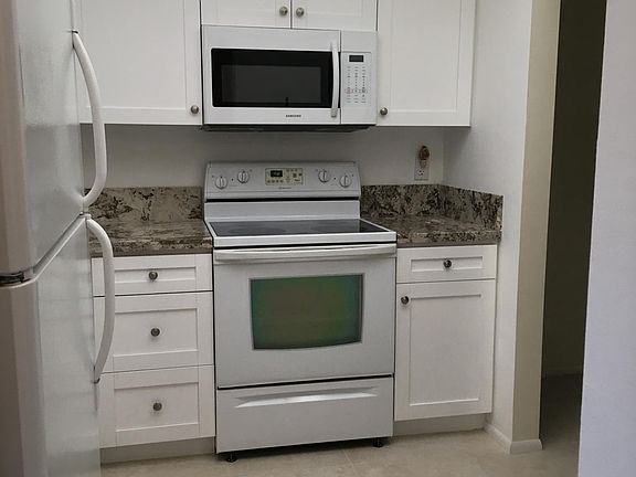 Kitchen area thru the hallway