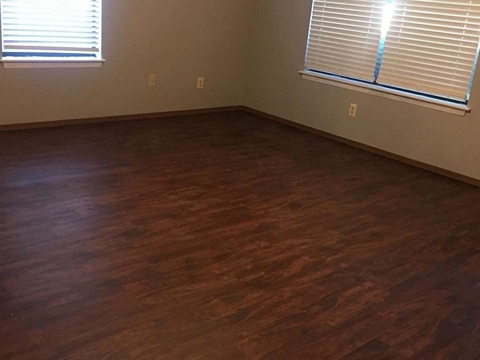 Nice, natural lighting in living room with new flooring, pai