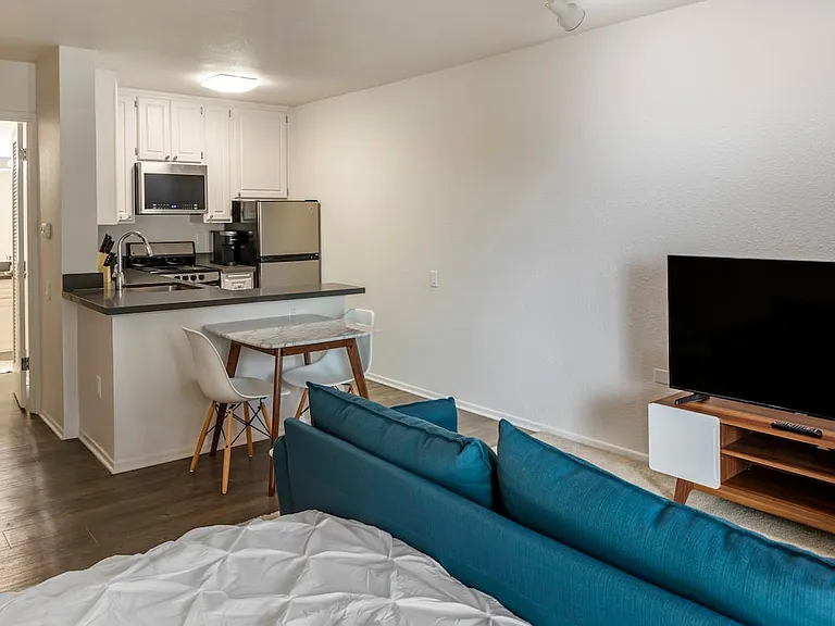 Furnished+ apartment homes include a dining set (Representative Image exact items and style of furnishings may vary)