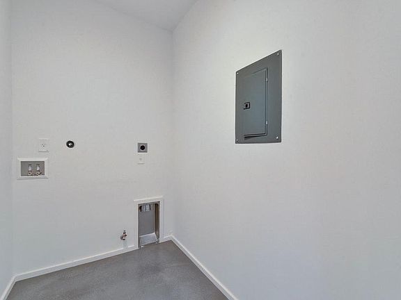 Laundry / Utility room now includes washer/dryer and upper storage cabinets.