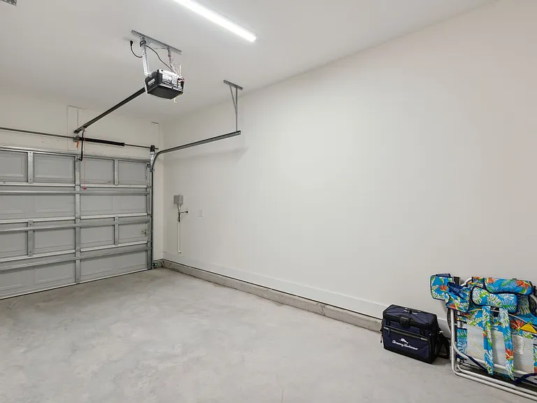 One car garage, beach chairs and cooler