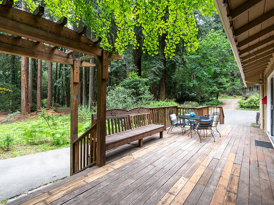Redwood deck with built-in benches and arbor
