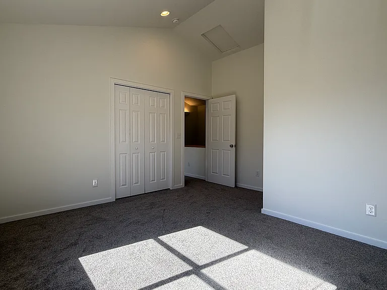 Primary bedroom looking at door to hallway