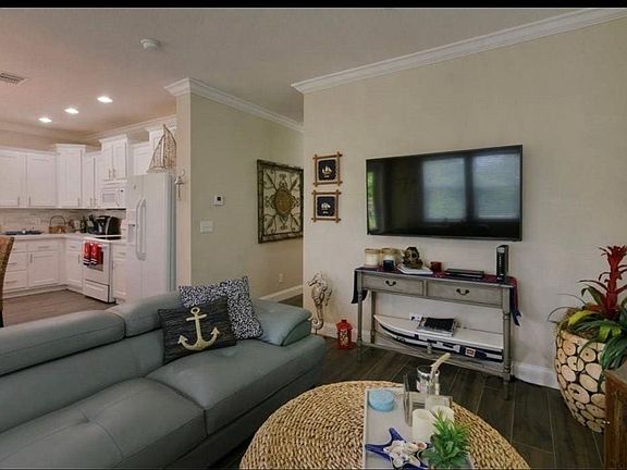 Large sectional with plenty of seating. Flat screen tv with cable included. Games and books.