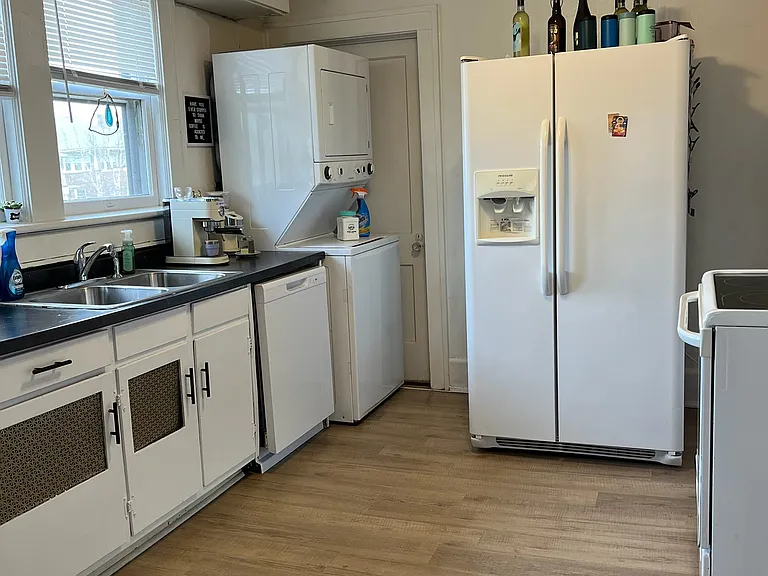 Kitchen w/ Side by Side Refrigerator w/ Ice maker, Stackable Washer/Dryer, Dishwasher and Flat Surface Stove. New Designer Ceiling Fan!