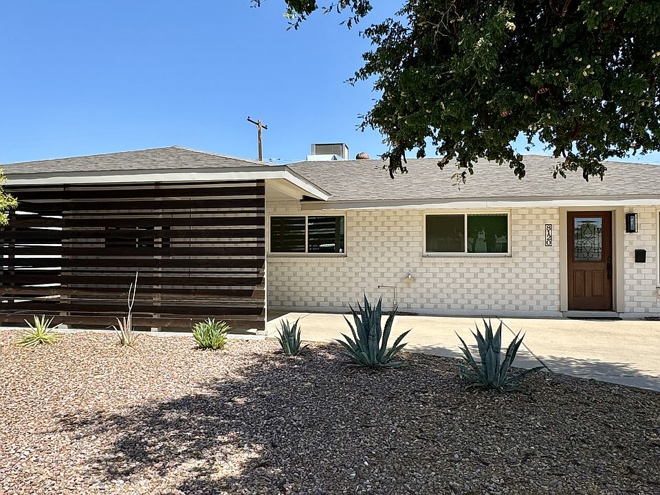 exterior with covered carport for one car