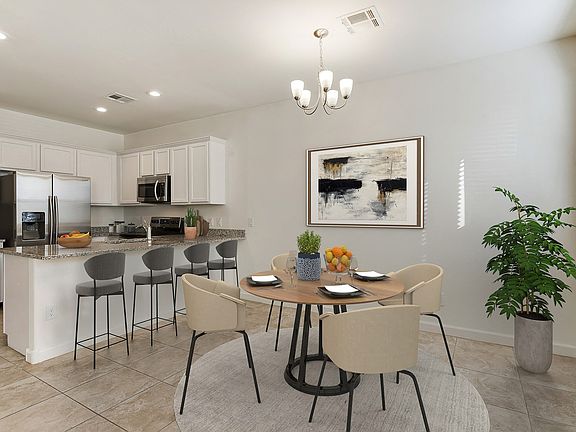 Dining area and kitchen with room for bar top seating