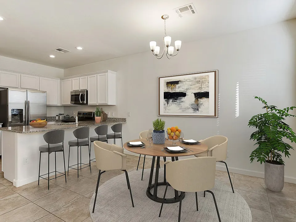 Dining area and kitchen with room for bar top seating