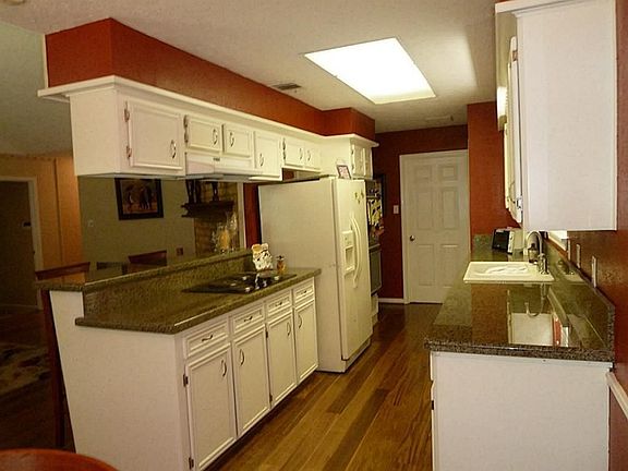 Granite countertops.  Electric stove, but it does have gas fittings if you decide to change to gas.