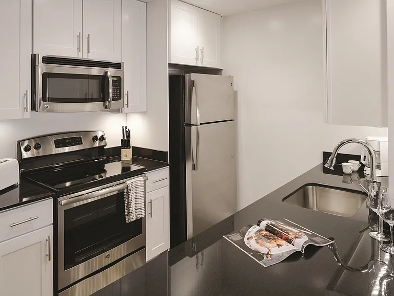Gourmet Kitchen with Dishwasher, Garbage Disposal, Microwave, Granite Countertops, and Modern Appliances