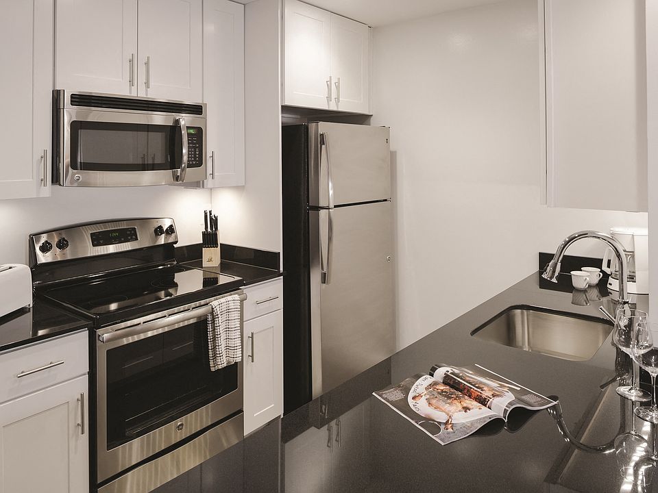 Gourmet Kitchen with Dishwasher, Garbage Disposal, Microwave, Granite Countertops, and Modern Appliances