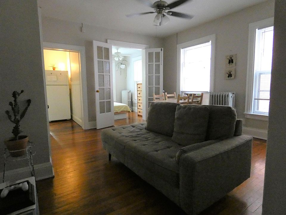 Living room, bedroom behind. Kitchen on left.