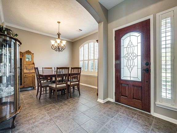 This inviting two-story entry is the perfect place to greet your guest.