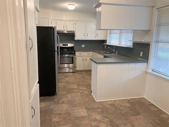 Kitchen and breakfast area. With lots of upper and lower cabinets.