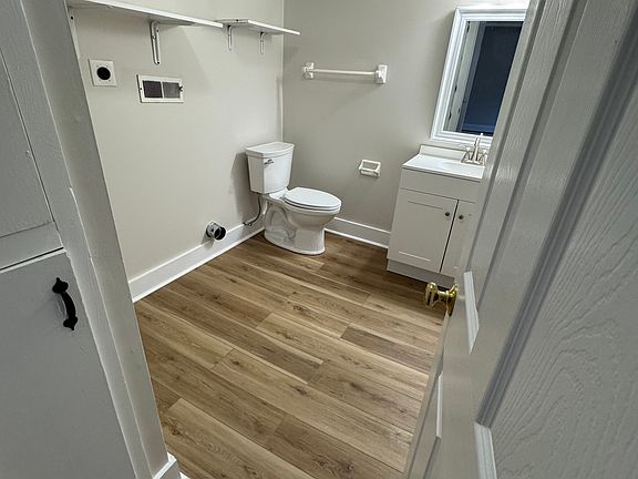 Newly remodeled half bathroom with washer/dryer hookup